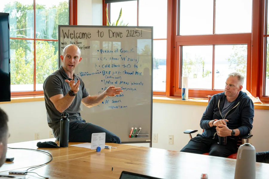 A speaker leading a discussion at a conference roundtable