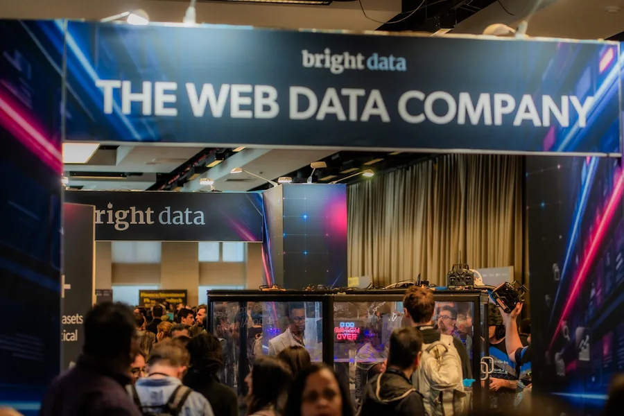 A Bright Data entrance framing a busy conference room