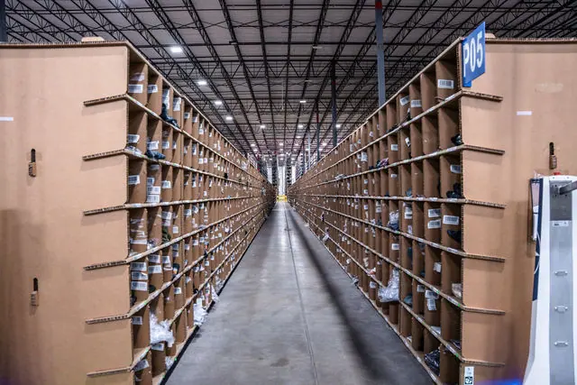 A symmetrical Barrett warehouse aisle lined with inventory