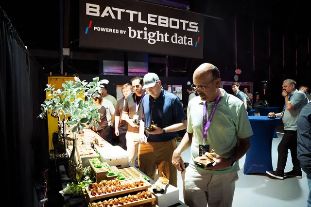 Guests beneath BattleBots powered by Bright Data branding