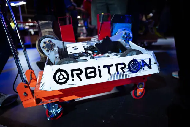 A BattleBots robot displayed under arena lighting at the Bright Data event