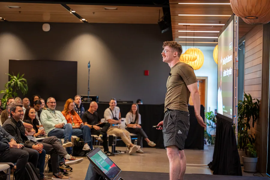 A speaker and audience sharing a light moment at Drive 2025