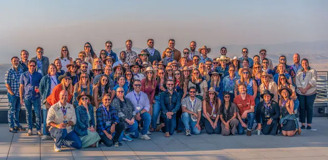 Highline attendees gathered for a group photograph in the mountains
