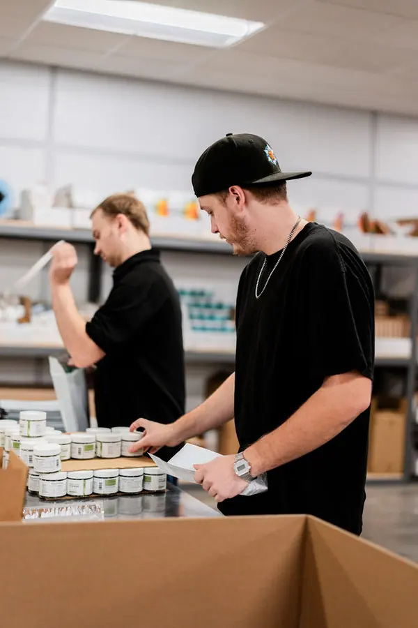 A close vertical view of product handling at Uptime Fulfillment