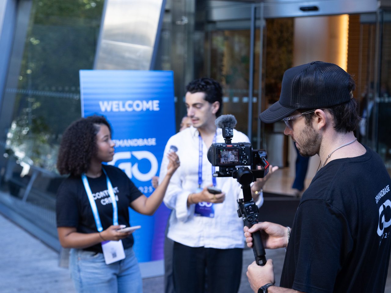 Filming a street-style interview at the Demandbase GO NYC welcome wall