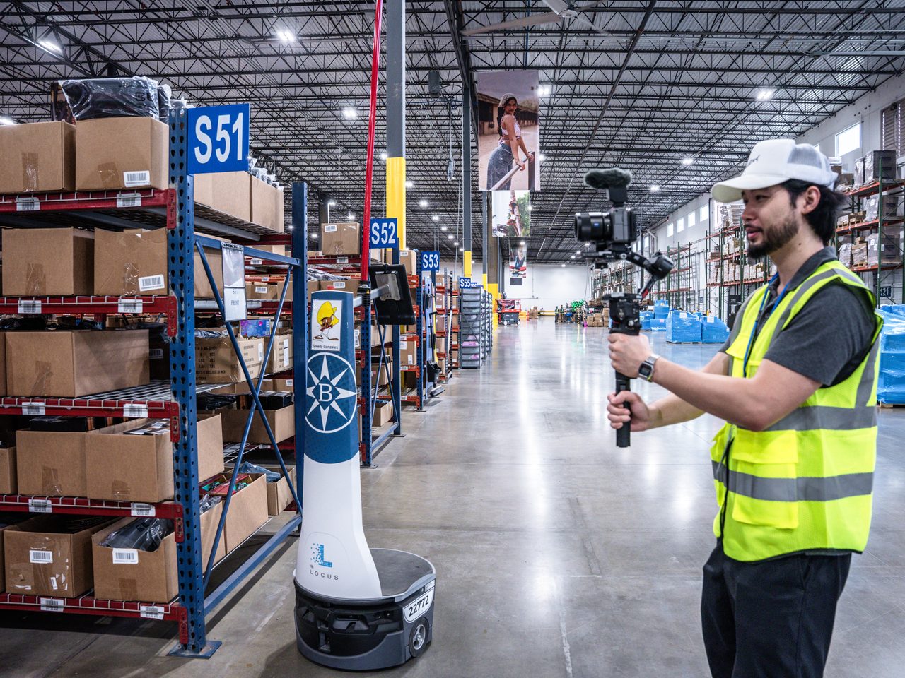 Filming a warehouse robot in a distribution center