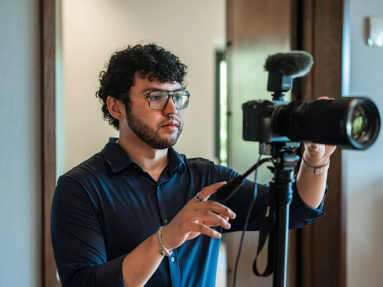 An EventShark camera operator adjusting a camera rig